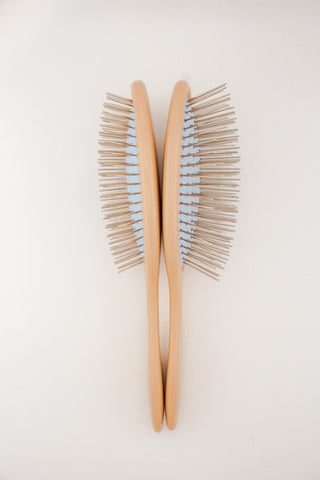 Two Detangling Brushes back to back, stainless steel bristles